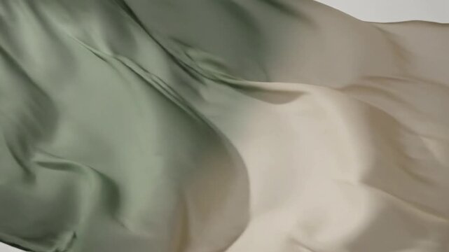 Abstract Fabric Drift Wide shot of multiple layers of muted duotone fabric gently swaying and overlapping, creating complex, ever-changing abstract patterns suitable for background use.