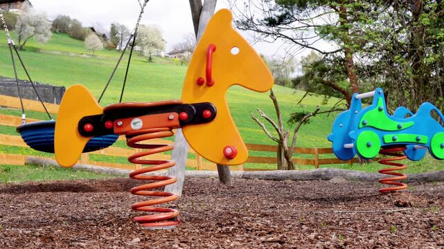 A happy cartoon vector illustration of a little boy and girl playing with an excavator construction toy in a sand garden at a fun spring park