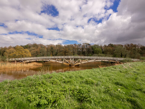 Very large Old wooden packhorse bridge spanning the river weaver, Cheshire, UK