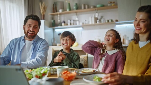 Breakfast family looking tab screen kitchen closeup. Children parents morning
