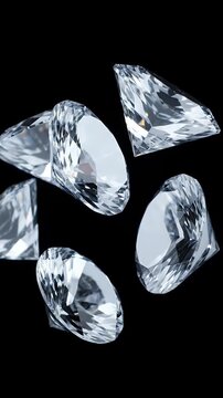 Shiny cut diamonds floating against a black background