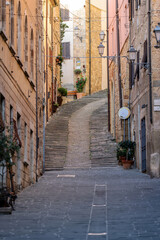 Obraz premium Steep and narrow street in old town of Massa Marittima, Italy