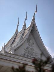 Ornate White Temple Roof Detail with Sculptures in Pattaya, Thailand