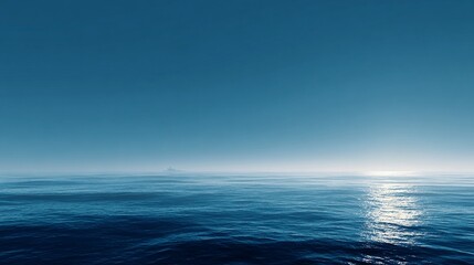 Fototapeta premium Serene Calm Blue Ocean at Sunrise with Gentle Waves and Misty Horizon