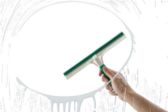 Hand using a squeegee to clean a soapy window, creating a clear circular path isolated on transparent background