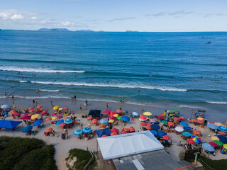 Top View Aerial of Colorful Beach Umbrellas and Waves in Garopaba, Brazil