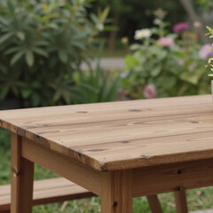 Fototapeta premium Wooden table amidst a blurred green nature garden backdrop