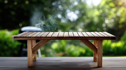 Fototapeta premium Empty wooden table ready for barbecue lunch, with smoke rising from grill in background, sunny garden with bokeh 