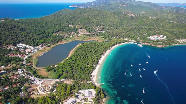 Aerial 4K Panorama of Koukounaries Beach and Strofilia Wetland Lagoon &mdash; European Tropics with Golden Sand and Pine Forest in Skiathos Greece
