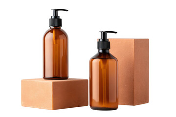 Two amber glass bottles with pumps on pedestals isolated on transparent background