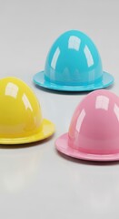 Fototapeta premium Colorful Playful Helmets for Children in Yellow, Blue, and Pink