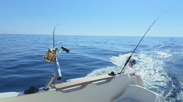 Offshore trolling fishing rods on boat in open sea