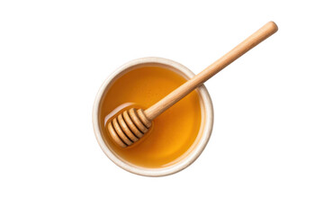 Wooden honey dipper in bowl of golden honey isolated on transparent background