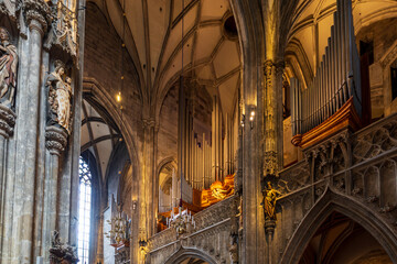 Fototapeta premium Low angle of the early 15th Century&nbsp;Imperial Court Chapel’s organ and ornate interior in the Hofburg Palace complex, Vienna, Austria