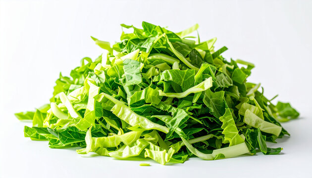 Vibrant shredded green cabbage piled on white background, fresh organic vegetable, tasty and crisp.
