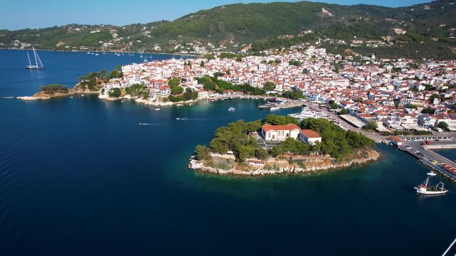 Greece Skiathos 4K Aerial Drone Pull Back Video of Old Port with Luxury Four Masted Sailing Yacht Frigate Opening Bourtzi Peninsula and Aegean Sea Coastline Travel