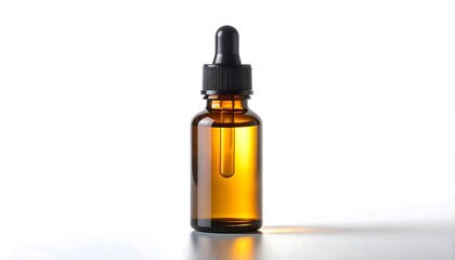 Fototapeta premium A sleek amber glass bottle with a black dropper, filled with a transparent golden liquid, is set against a pristine white backdrop