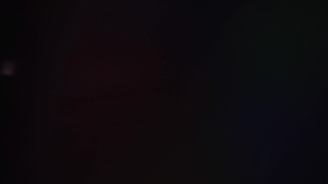 Vibrant Cinematic Lens Flare Overlay on Black Background. High quality 4k footage