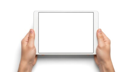 Naklejka premium Hands holding a digital tablet from a top view displaying a blank screen on a white surface.