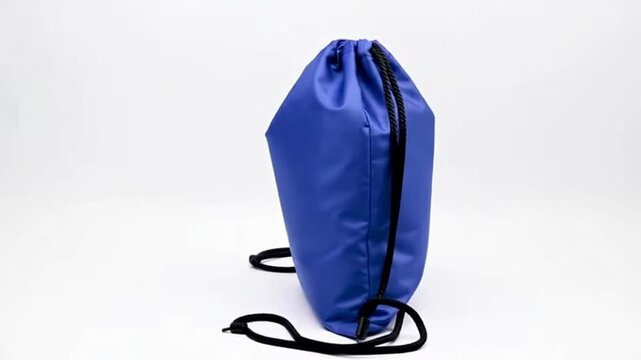 High-Quality Stock Footage: Blue Drawstring Backpack Isolated on White Background