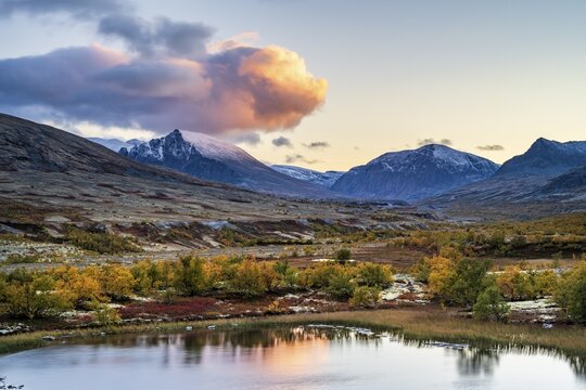 Mountains and lake in autumnal mountain landscape, Rondane National Park, Norway