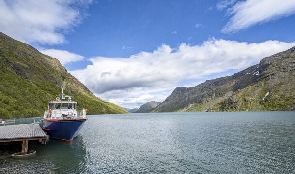 Boat at the jetty, end point of the traverse of the Besseggen Ridge, Lake Gjende, Jotunheimen National Park, V&aring;g&aring;, Innlandet, Norway