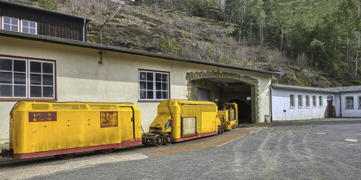 Miners' transportation railway entering a mine gallery, Rammelsberg mine site, Goslar, Harz, Lower-Saxony, Germany