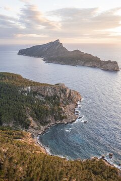 View of mountains and coast with sea, at sunset, hiking to La Trapa from Sant Elm, at the back of Sa Dragonera Island, Serra de Tramuntana, Majorca, Spain