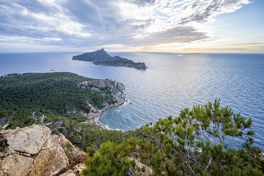 View of mountains and coast with sea, hiking to La Trapa from Sant Elm, in the back island Sa Dragonera, sunset, Serra de Tramuntana, Majorca, Spain