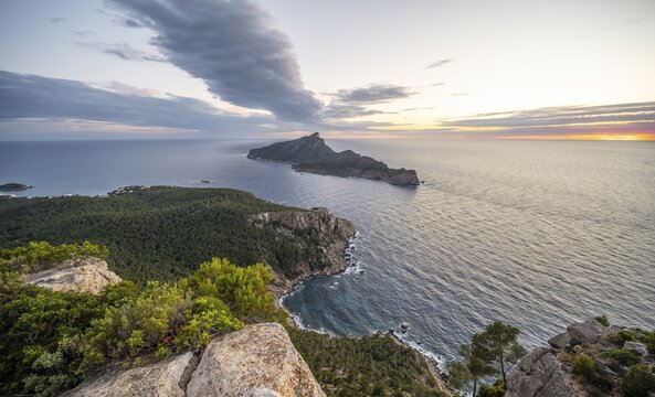 View of mountains and coast with sea, at sunset, walking to La Trapa from Sant Elm, back island of Sa Dragonera, Serra de Tramuntana, Majorca, Spain