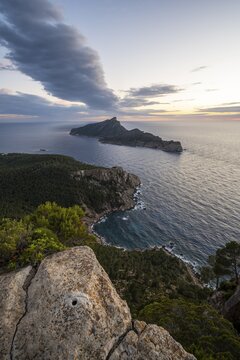 View of mountains and coast with sea, at sunset, walking to La Trapa from Sant Elm, back island of Sa Dragonera, Serra de Tramuntana, Majorca, Spain