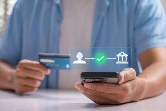 Mobile payment and secure online banking transaction concept. man using smartphone and credit card, verifying digital transfer through mobile app for fast, safe, and seamless financial service