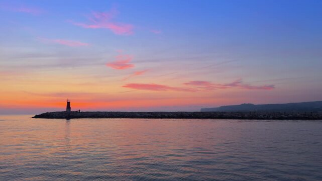 Denia sunrise over Cape San Antonio calm Mediterranean sea