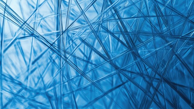 Blue abstract background featuring a tangled web of glass-like threads creating a sense of complexity and connection.