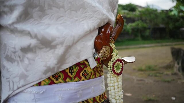 Traditional Southeast Asian white wedding dresses complete with decorations and ornaments, and are worn by the bride and groom. Real time outdoor natural lighting RAW no edit footage video file