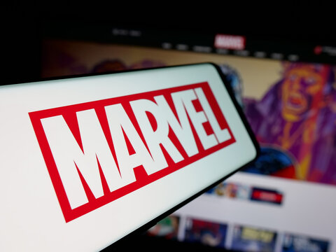 Stuttgart, Germany - 01-19-2026: Smartphone with logo of comic production company Marvel Studios LLC on screen in front of website. Focus on center-left of phone display.