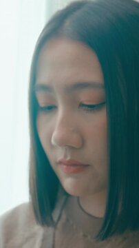 Vertical Screen : Young Asia female freelance typing write prompt AI bot IT app program nomad, video game, terminal with coding language, user interface, designer, big data center on desktop computer.