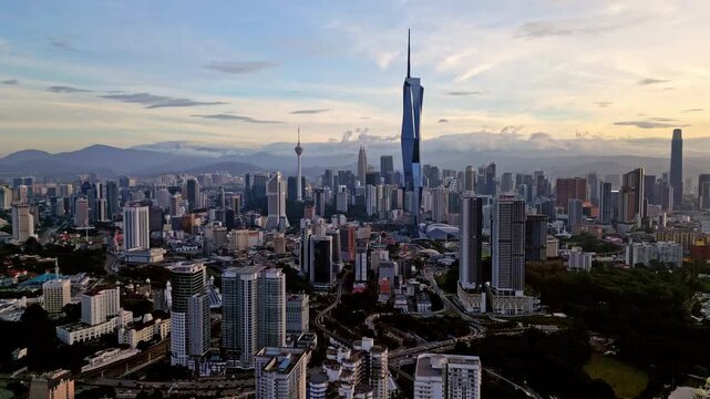 Aerial view of high-rise buildings, including KL Tower and Merdeka 118, contrasting with the lush greenery, Kuala Lumpur, Federal Territory of Kuala Lumpur, Malaysia.