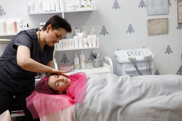 Obraz premium A girl at a cosmetologist's appointment. Skin problems. Acne.