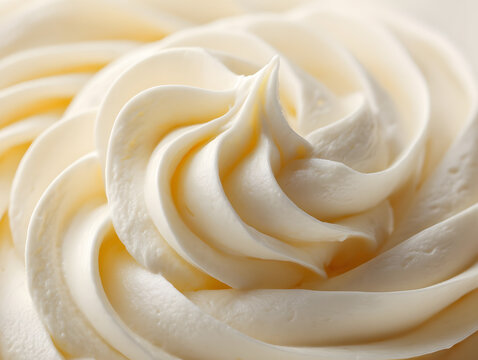 Swirl of creamy frosting isolated on white background