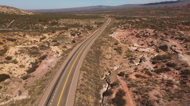 Aerial view of a tarmac road across the desert in Mendoza, Argentina.