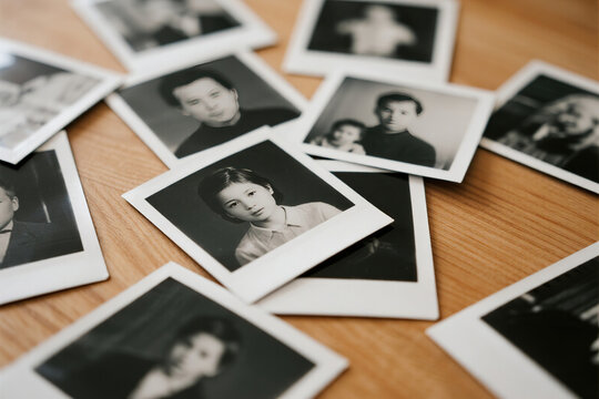 Scattered black and white photo prints