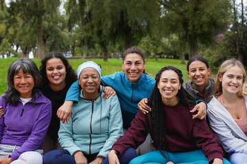 Group of happy multiracial women circle smiling on camera outdoor - Female multi generational...