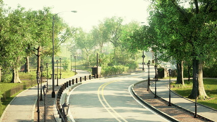 Obraz premium A winding pathway surrounded by vibrant trees and gentle sunlight invites visitors to explore the serene park. The path, lined with lamps, offers a peaceful escape in nature.