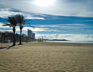 Windy day over beach. Alicante after season.