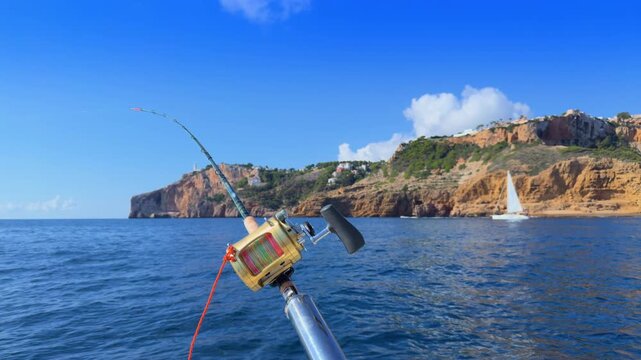 Costa Blanca trolling fishing rods on boat near Cape de la Nao in Alicante