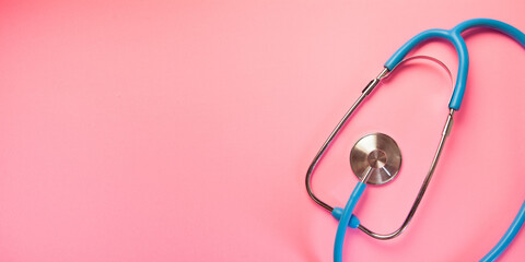 Stethoscope isolated on pink background. Health care and medical concept.