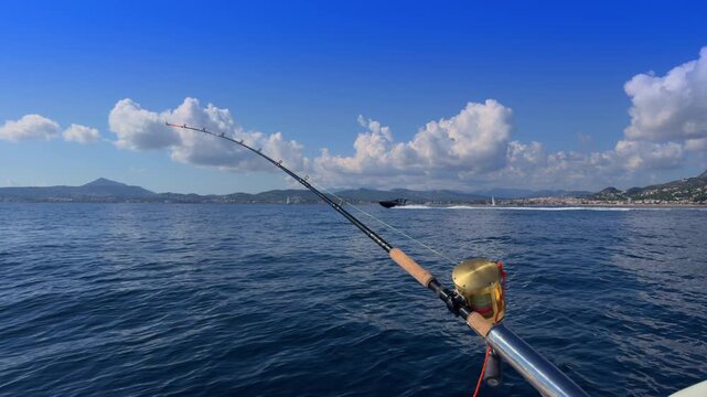 Javea bay trolling fishing rod on boat Mediterranean Costa Blanca