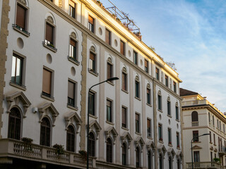 Old residential buildings along via Plutarco in Milan, Italy