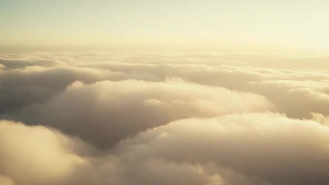 Golden light illuminating a boundless sea of fluffy cumulus clouds, creating a peaceful and serene atmospheric background symbolizing freedom, dreams, and potential